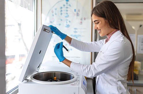 Medical lab student checking on samples