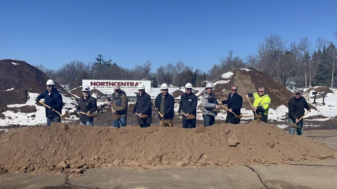 Gov. Evers poses with a shovel during the groundbreaking ceremony
