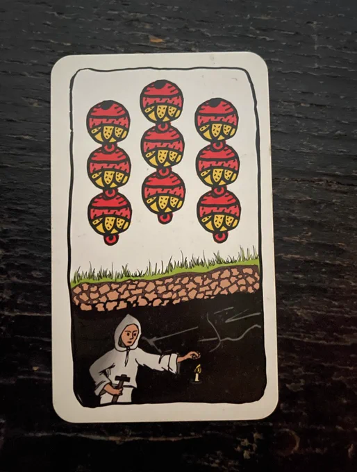 playing card wiht bells and a miner underground