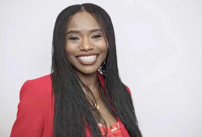Photo of Yetunde smiling at the camera.
