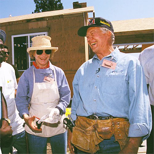 Rosalynn Carter and President Jimmy Carter building with Habitat for Humanity. 