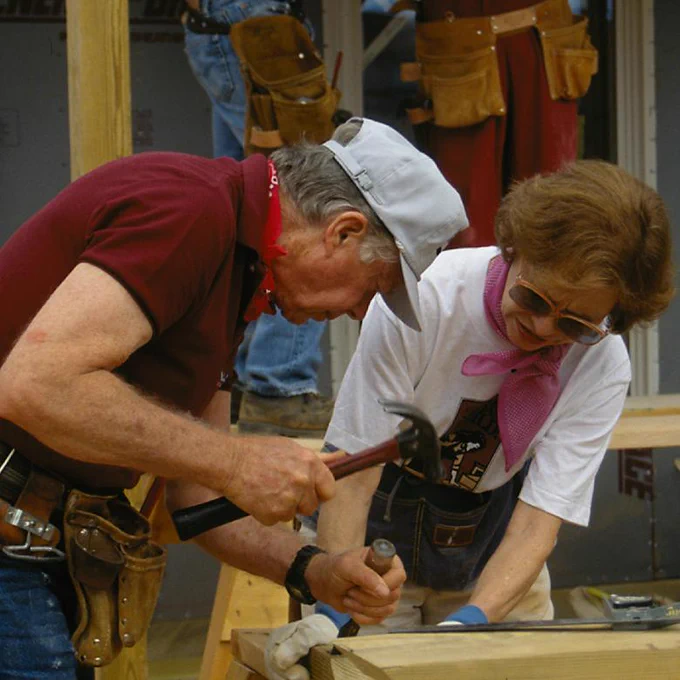Rosalynn Carter and President Jimmy Carter building with Habitat for Humanity. 