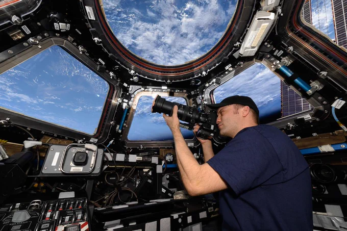 iss072e035863 (Oct. 11, 2024) --- NASA astronaut Matthew Dominick points his camera out a window on the cupola as the International Space Station orbited 262 miles above the Atlantic Ocean off the coast of Africa.
