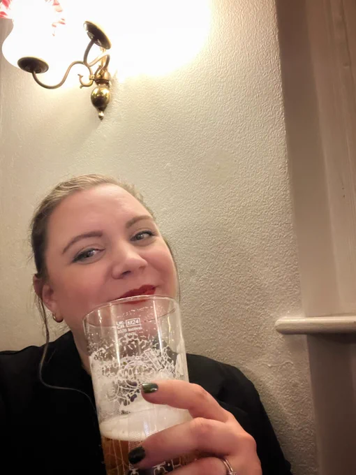 Me with a pint of beer - half full - on News Years Eve