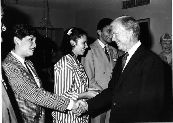 In February 1986, in Caracas, Venezuela, President Jimmy Carter meets Humphrey alumni.