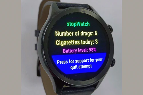 The smartwatch with the custom app showing a prevention message
