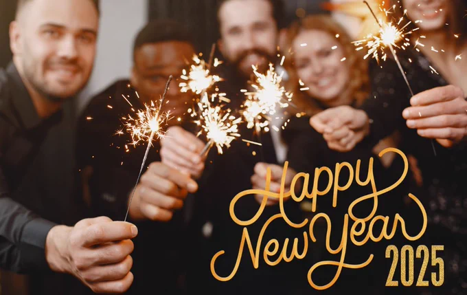 A group of people holding sparklers and celebrating New Years Day. 