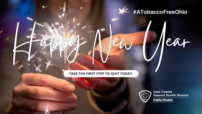 A person holding a sparkler. In-image caption: Happy New Year - take the first step to quit today. #A Tobacco Free Ohio