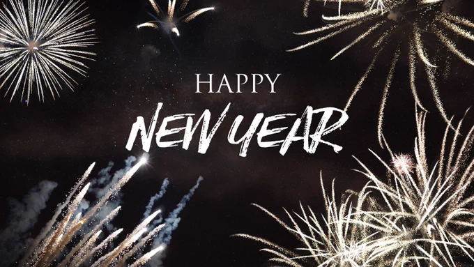 Happy New Year text with a background of sparkling and bursting fireworks in a night sky.
