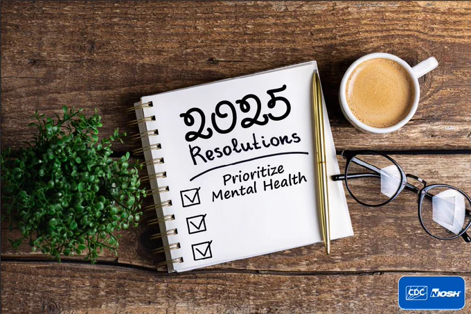A notebook on a wooden desk with "2025 Resolutions: Prioritize Mental Health" written on it, beside a cup of coffee, a pair of glasses, and a small green plant with the CDC and NIOSH logos in the bottom right corner.