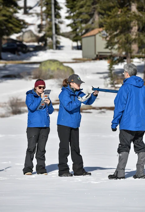 DWR staff conducting the first snow survey of the season at Phillips Station. Photo taken January 2, 2025.