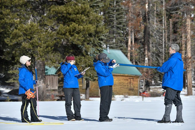 DWR staff conducting the first snow survey of the season at Phillips Station. Photo taken January 2, 2025.
