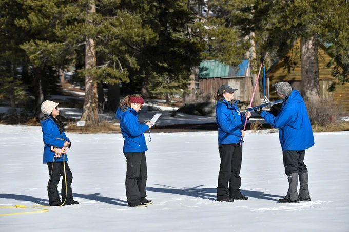 DWR staff conduct the first snow survey of the season at Phillips Station. Photo taken January 2, 2025.