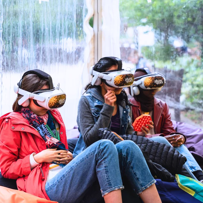 Three students playing a virtual reality game