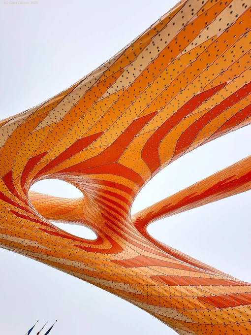 Agent crystalline sculpture in shades of orange viewed from underneath