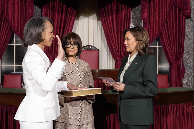 Sen. Lisa Blunt Rochester being ceremonially sworn in to the United States Senate by Vice President Kamala Harris. Her mother, Mrs. Alice LaTrelle Blunt, holds the Bible.