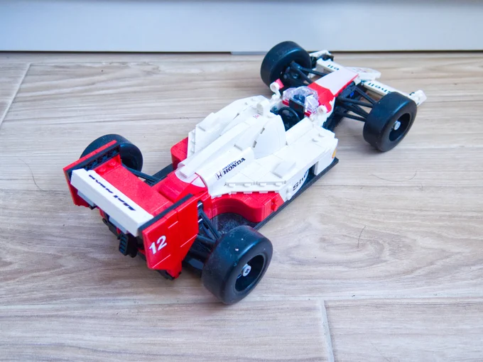 High angle, rear three-quarters shot of a Lego version of a 1988 McLaren MP4/4 Formula One car