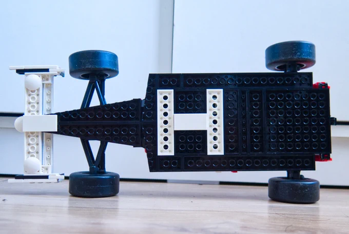 Undertray shot of a Lego version of a 1988 McLaren MP4/4 Formula One car, showing via Lego what's usually underneath a Formula One car