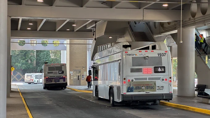 Two MARTA buses servicing King Memorial Station. 