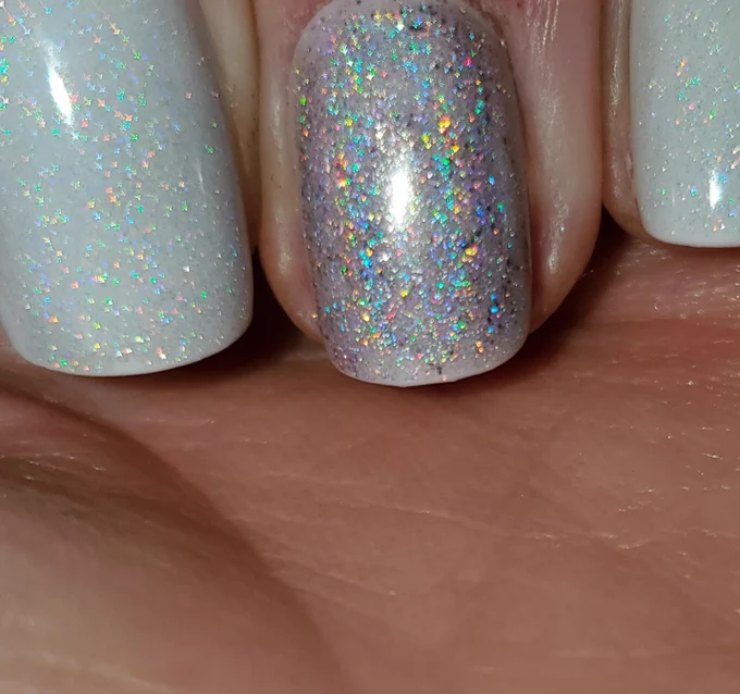 Dream Girl is a super feminine light-orchid holographic nail polish with a serious sparkle