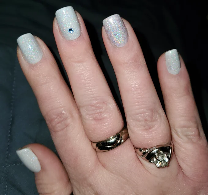 opaque pale lilac gray short squoval nails with modelones sheer rainbow sparkle (shimmery sparkle, not glitter) gel top coat