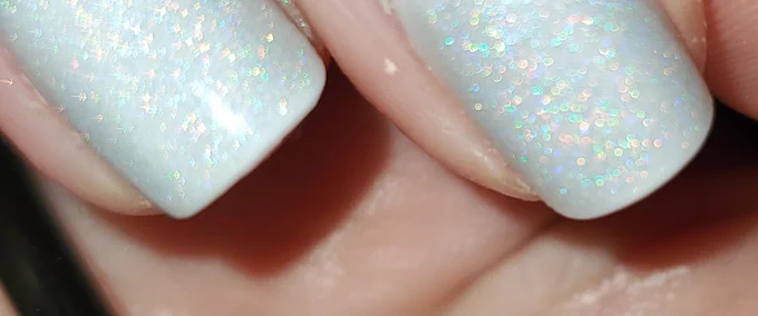 opaque pale lilac gray short squoval nails with modelones sheer rainbow sparkle (shimmery sparkle, not glitter) gel top coat