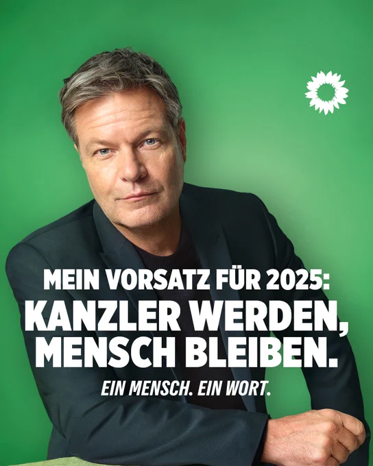 Ein Foto von Robert Habeck vor grünem Hintergrund. Er schaut in die Kamera. Auf dem Foto steht geschrieben: Mein Vorsatz für 2025: Kanzler werden, Mensch bleiben. Ein Mensch. Ein Wort.