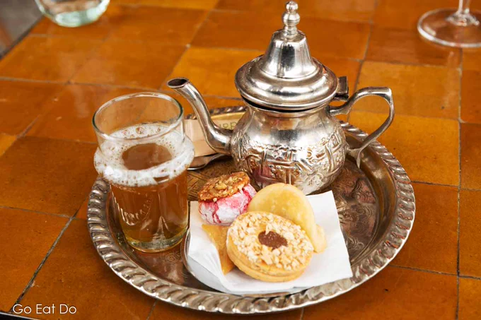 Mint tea served from a traditional teapot at a rooftop cafe in Marrakech, Morocco 