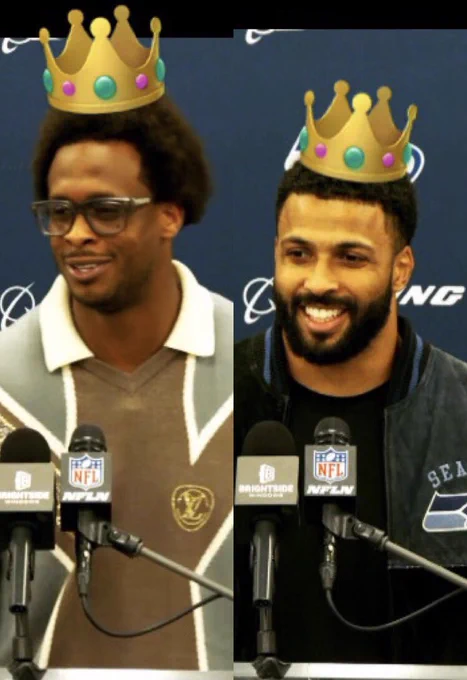 Two photos:
Left: smiling QB Geno Smith standing at the post-game presser lectern with two microphones. He is wearing large-frame glasses. He is wearing a cream-collared vest-neck sweater that is gold, brown, and khaki with cream trim and a gold logo. Background is navy. An emoji crown has been added to his head.

Right: smiling DB Julian Love standing at the post game presser lectern with two microphones, the left of which has the NFL shield logo on it, he is wearing a dark crew neck shirt under a Seahawks jacket. The background is navy. An emoji crown has been added to his head.