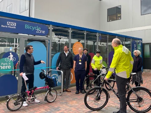 People standing with their bikes
