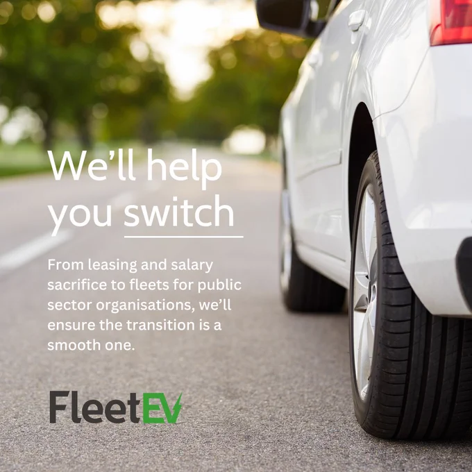 A close up of a white EV with text in the bottom left corner. 