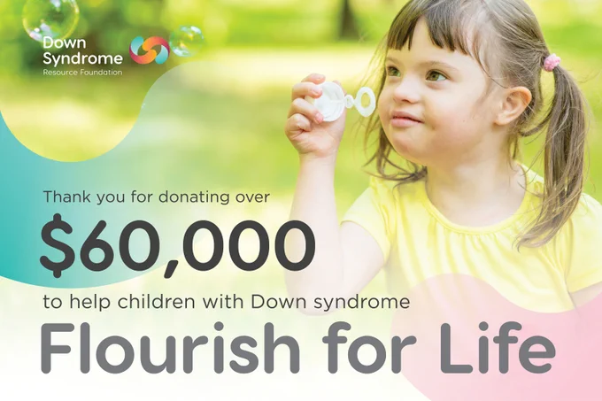 brown haired girl with Down syndrome wearing yellow t-shirt blows bubbles outdoors. Text: Thank you for donating over $60,000 to help children with Down syndrome Flourish for Life