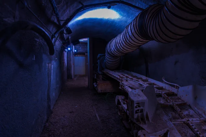 the tunnel in darkness with sections of light