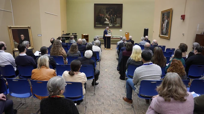 Chancellor Michael F. Collins speaking to the crowd gathered for the opening reception for the First Operation Under Ether