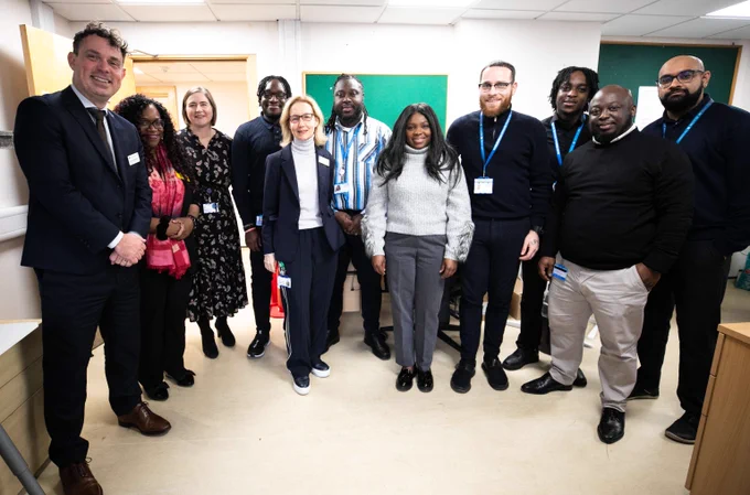 Pete with colleagues in a room at North Mid hospital.