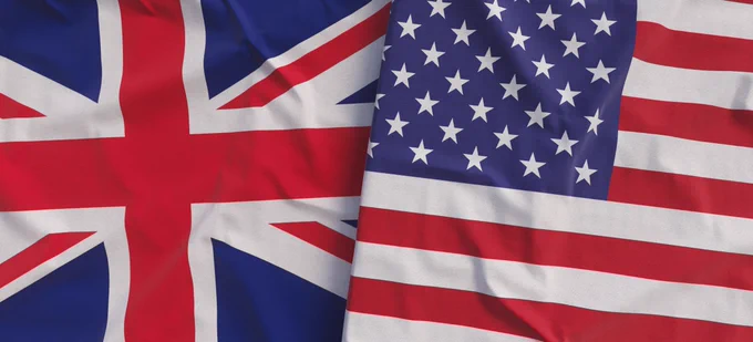 The flags of the United Kingdom and the United States of America intertwined. 