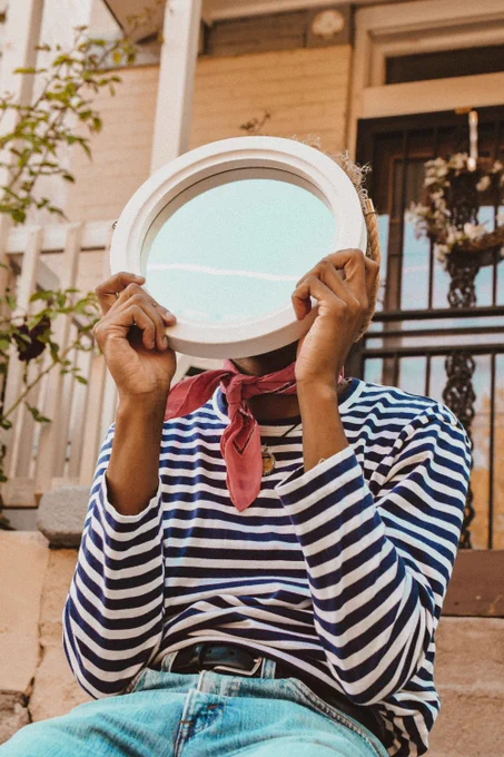 Photo by Kenzie Kraft on Unsplash:

https://unsplash.com/photos/person-in-striped-shirt-holding-round-mirror-Oh81uk8CoEA