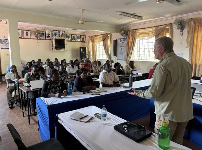 a class room full of aquaculture producers learning biosecurity practices