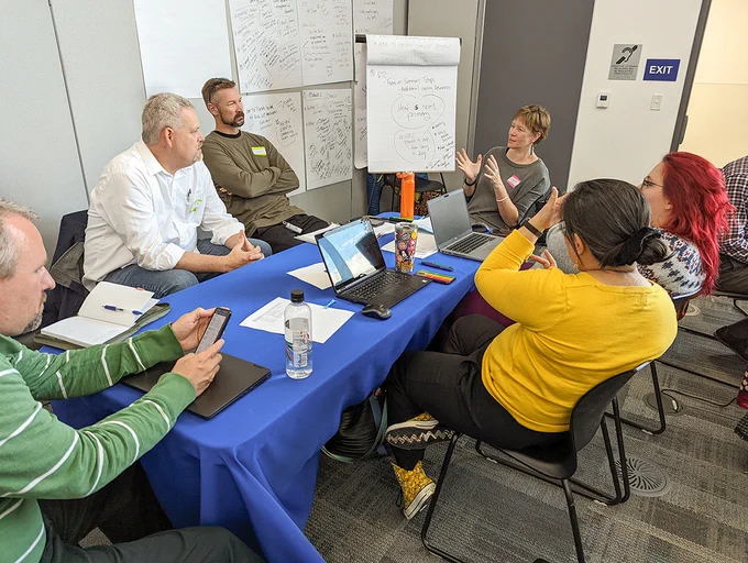 Community members work together to brainstorm heat resilience strategies during a Las Vegas heat tabletop exercise in December 2022. Image credit: Hunter Jones 