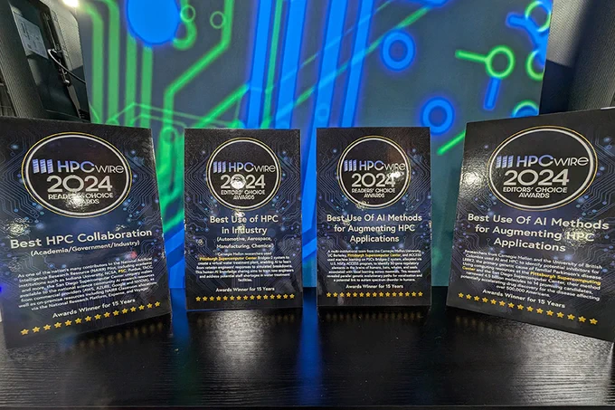A photo of four HPCwire Awards: one for Best HPC Collaboration, one for Best Use of HPC in Industry and two for Best Use of AI Methods for Augmenting HPC Applications.