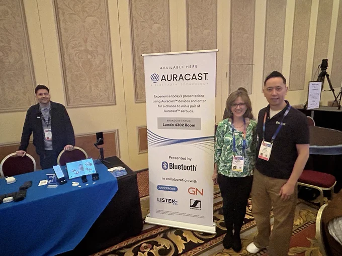 HLAA Executive Director Barbara Kelley with Henry Wong of Auracast