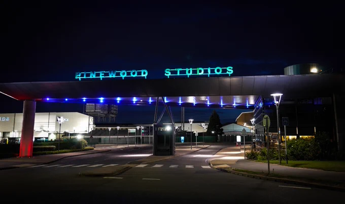 Entrance to Pinewood studios at night time