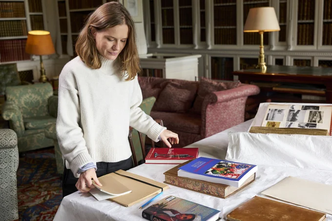 A person looking at research materials inside a property.