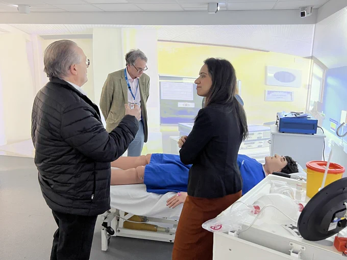 Image shows governors looking around the immersive simulation suite.
