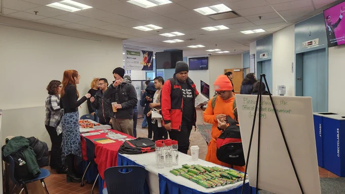 people stand in front of booth