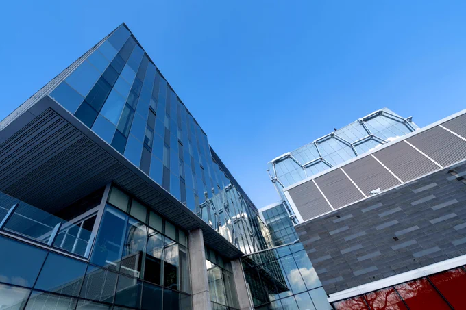 A photo from the ground looking up at the QNC building on the main campus of the University of Waterloo