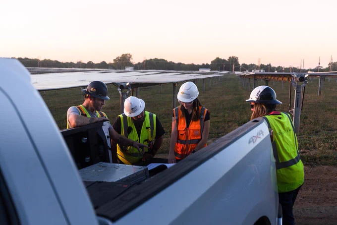 Sol Systems team collaborating on-site to power a sustainable future. 