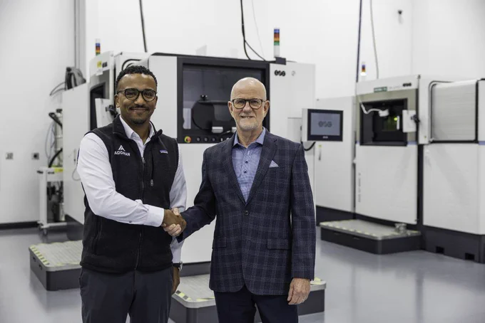 Joe Calmese, CEO of ADDMAN, and Glynn Fletcher, president of EOS North America, mark the installation of EOS’s 5,000th industrial 3D printer. Photo via ADDMAN.