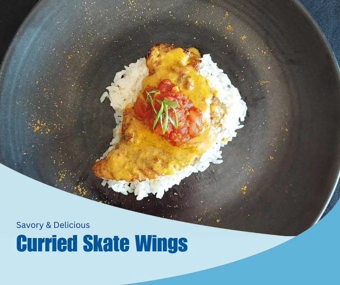 A graphic with a background photo of curried skate wings over white rice. In the foreground, two blue swooshes. Dark blue text over the swooshes reads "Savory and delicious curried skate wings" Credit: Chef Tyler Hadfield, The Barley Neck Collaboration with Cape Cod Commercial Fishermen’s Alliance