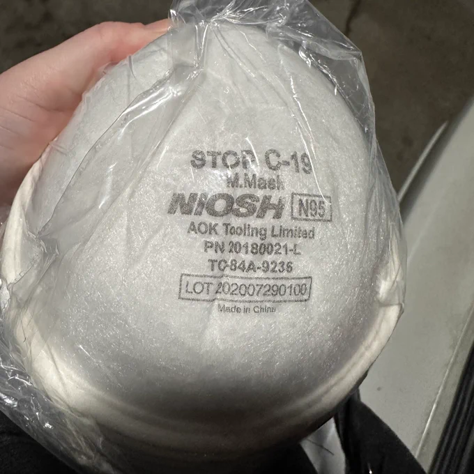 cup n95s that read 
STOP C-19
M. Mack
MOSH ING
AOK Tooling Limitad
PN 20180021-1
TC84A-9236
LOT 202007290109
